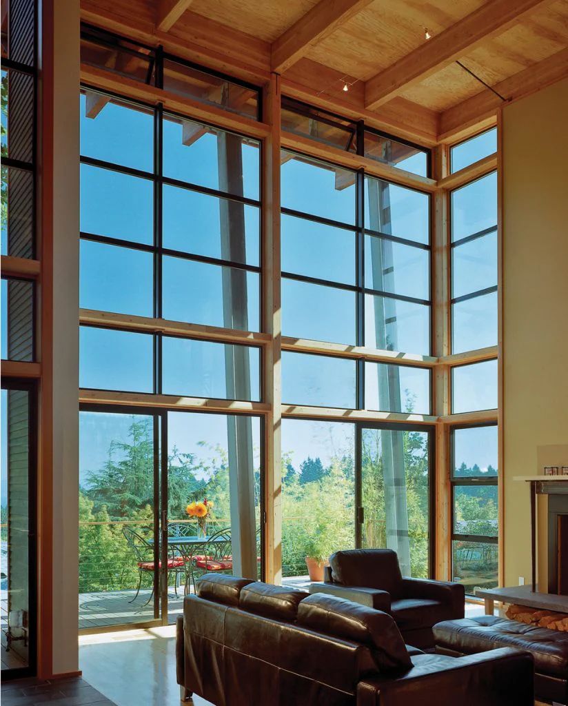 Floor-to-ceiling glass wall with black aluminum frames